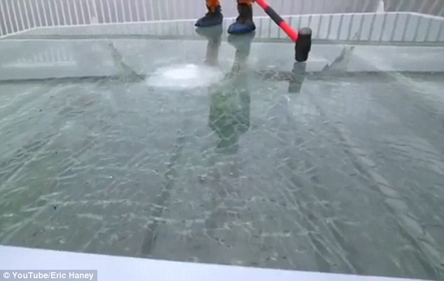 Despite smashing the top layer of glass with a number of blows from the sledgehammer, the two reinforced layers of glass below the surface remain intact
