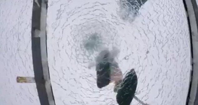 Despite smashing the top layer of glass with a number of blows from the sledgehammer, the two reinforced layers of glass below the surface remain intact
